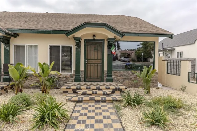 a front view of a house with garden