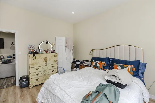 a bedroom with a bed and a car