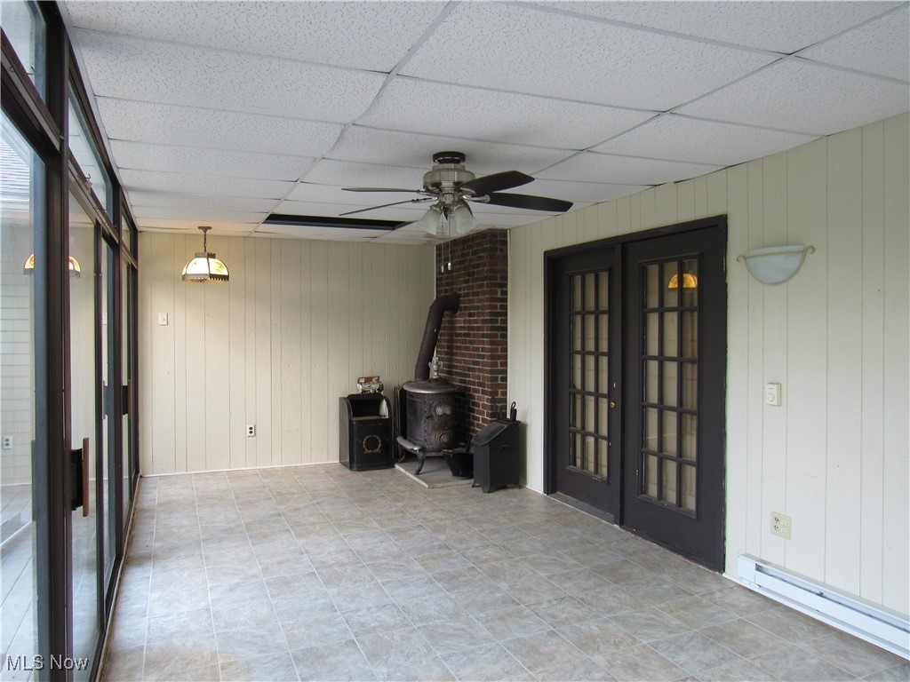 1120 Vincent Road Southeast North Canton, OH 44720 - Photo 46 of 50 Sun Room and Heating Stove