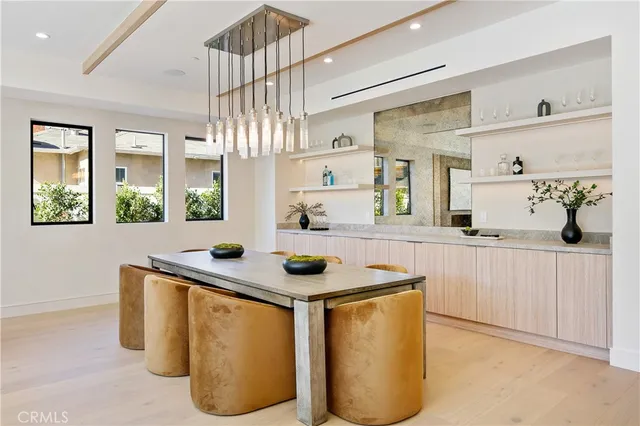 a living room with fireplace furniture and a large window