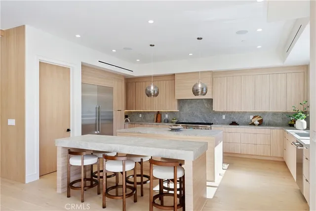 a view of a living room with furniture and floor to ceiling window