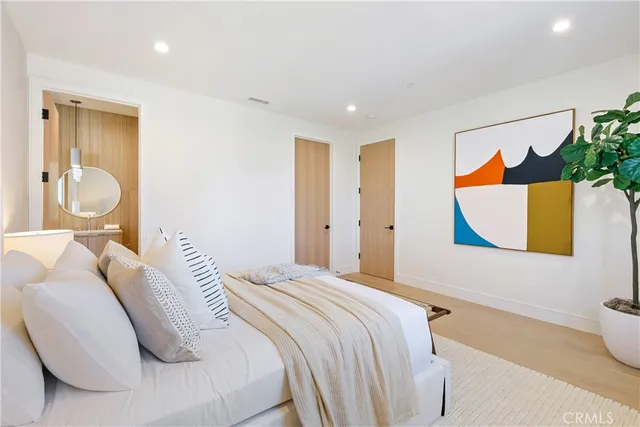 a view of a patio with couches table and chairs and potted plants