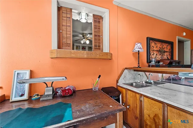 a bedroom with furniture and a window