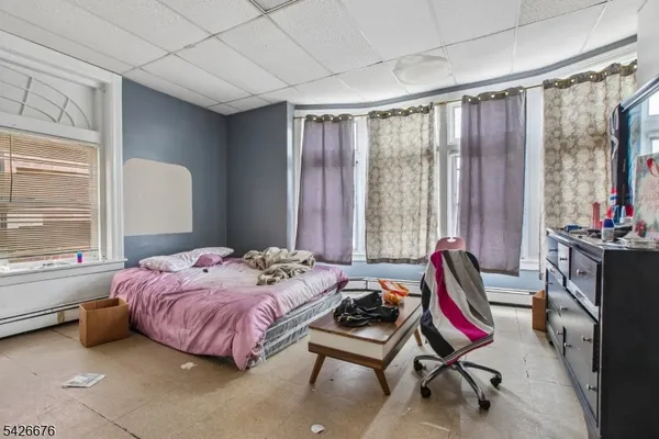 a bed room with a bed and a chair