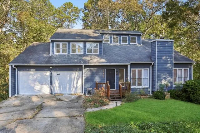 a front view of a house with table and chairs