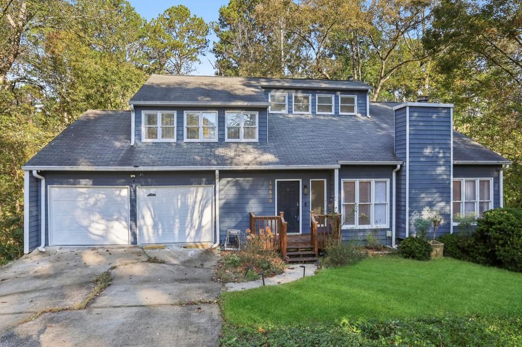 a front view of a house with table and chairs