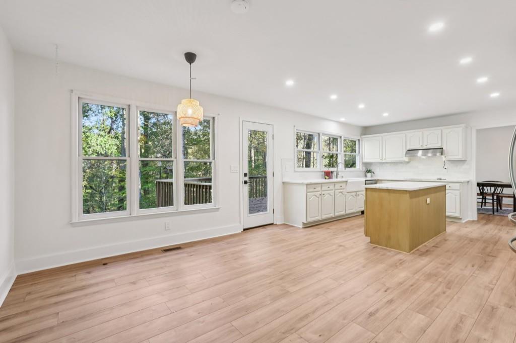 10630 Timberstone Road Alpharetta, GA 30022 - Photo 14 of 42 a view of a kitchen with a sink cabinets and wooden floor