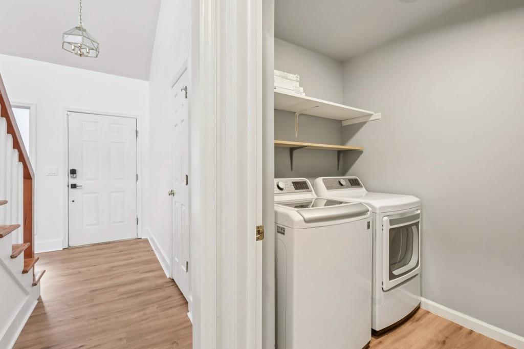 10630 Timberstone Road Alpharetta, GA 30022 - Photo 19 of 42 a view of a storage and utility room with washer and dryer