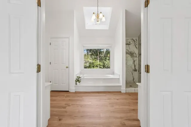 a bathroom with a sink a mirror and a large mirror