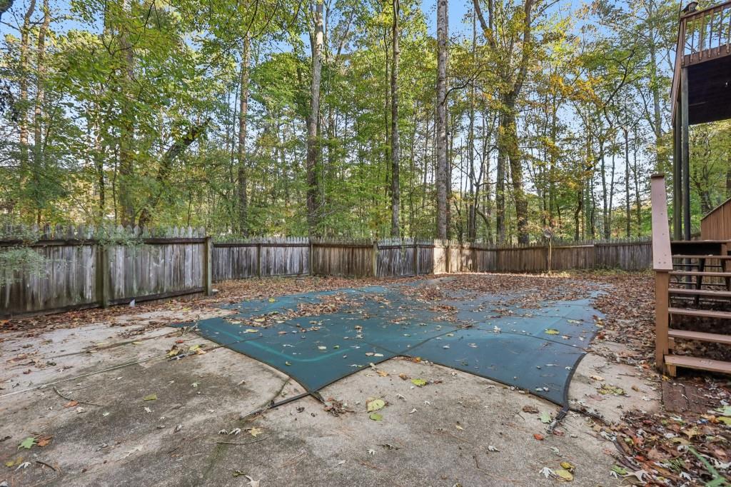 10630 Timberstone Road Alpharetta, GA 30022 - Photo 37 of 42 a backyard of a house with lots of green space