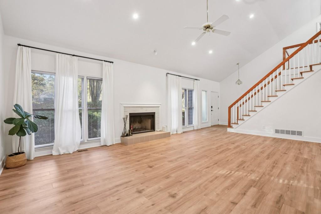 10630 Timberstone Road Alpharetta, GA 30022 - Photo 5 of 42 a view of empty room with wooden floor and fan