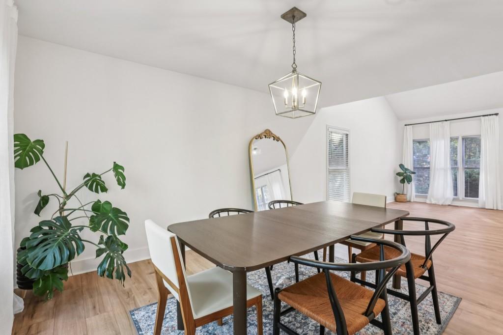 10630 Timberstone Road Alpharetta, GA 30022 - Photo 8 of 42 a view of a dining room with furniture window and wooden floor