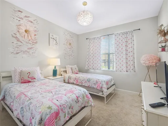 a bedroom with bed and a window