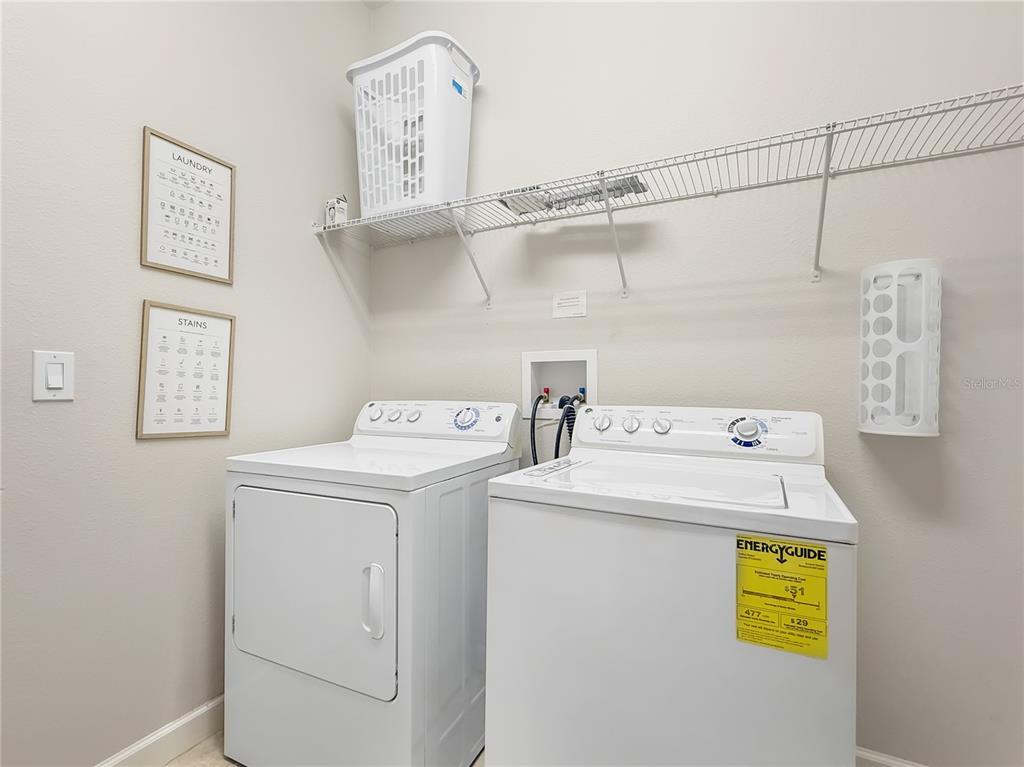 2942 Buccaneer Palm Road Kissimmee, FL 34747 - Photo 25 of 39 a utility room with dryer and washer