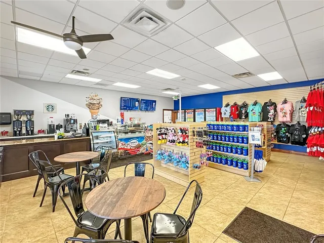 a room with lots of furniture and white walls