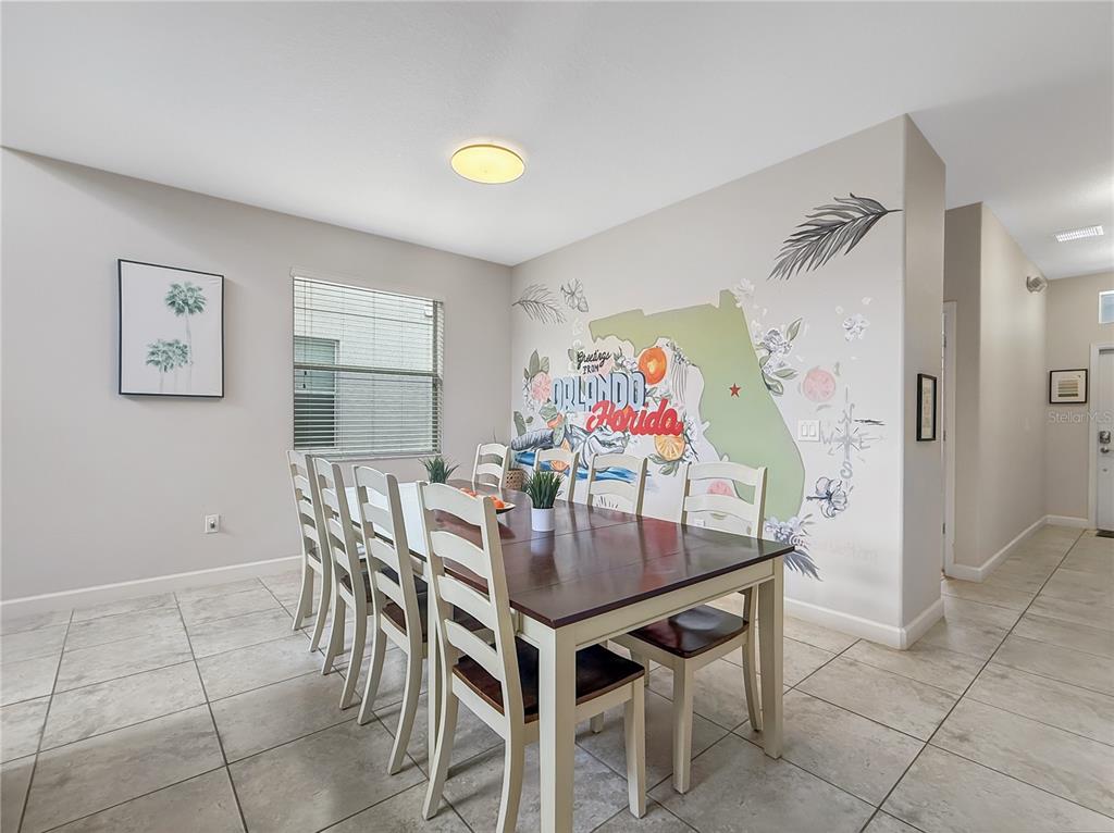 2942 Buccaneer Palm Road Kissimmee, FL 34747 - Photo 10 of 39 a view of a dining room with furniture