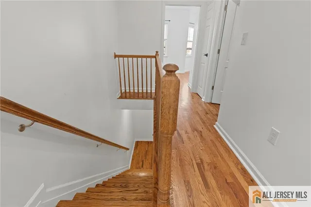 a view of entryway with wooden floor