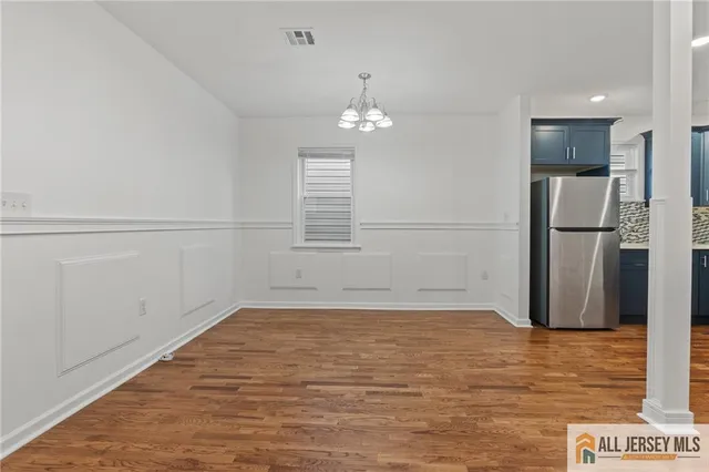 a view of a livingroom with wooden floor