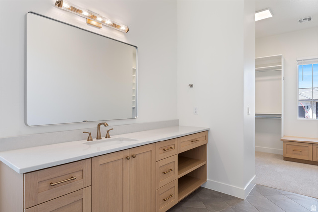 1192 East Corral Way Washington, UT 84780 - Photo 28 of 81 Light wood-finish vanity with a white countertop and rectangular sink