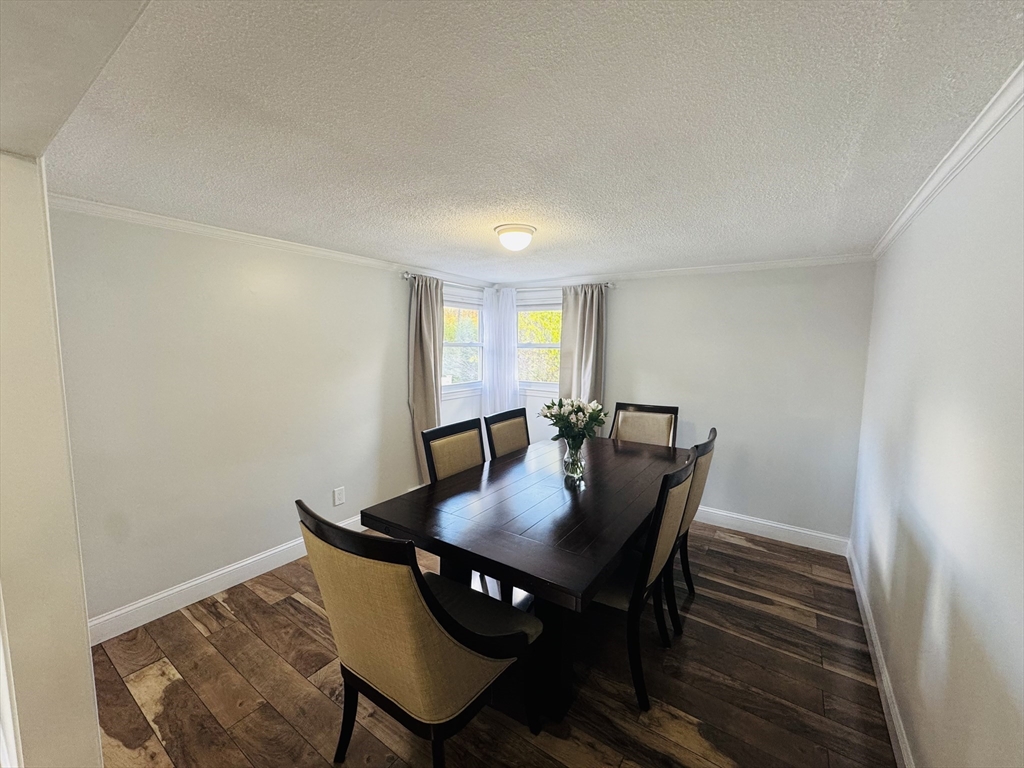 27 Fitchburg Street Marlborough, MA 01752 - Photo 13 of 37 a view of a dining room with furniture and wooden floor