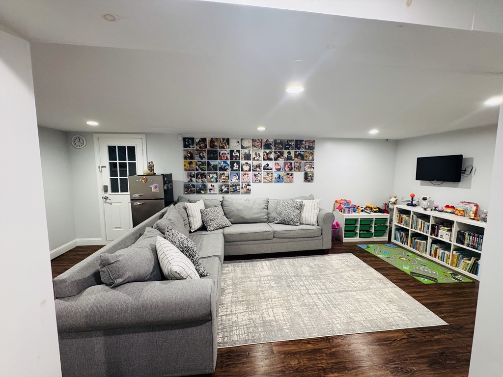 27 Fitchburg Street Marlborough, MA 01752 - Photo 17 of 37 a living room with furniture and a flat screen tv