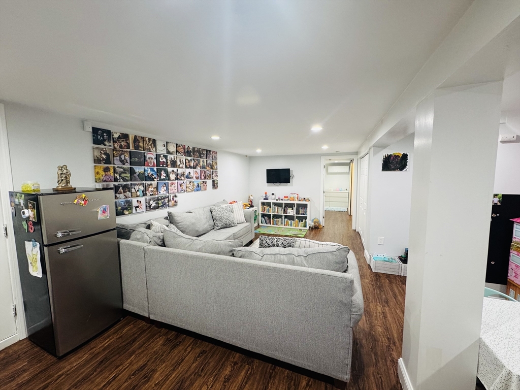 27 Fitchburg Street Marlborough, MA 01752 - Photo 21 of 37 a living room with furniture and a wooden floor