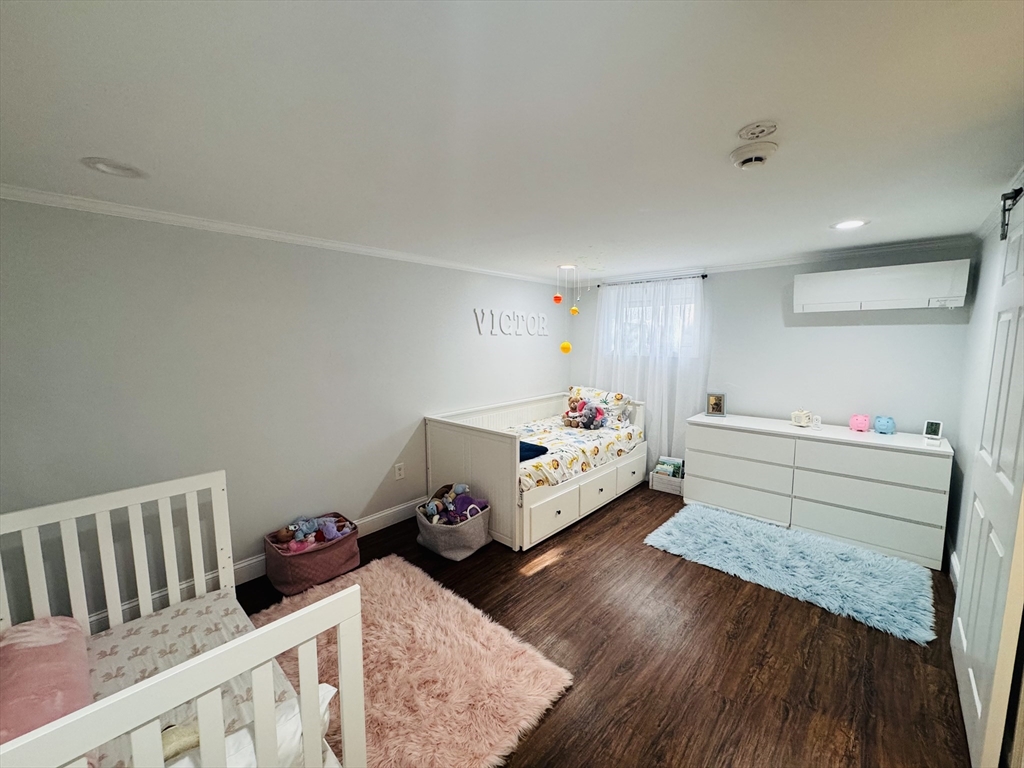 27 Fitchburg Street Marlborough, MA 01752 - Photo 25 of 37 a bedroom with furniture and a wooden floor