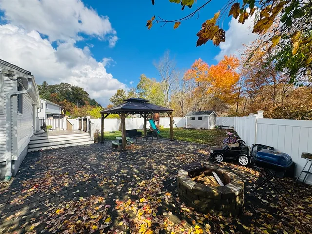 a view of a backyard with sitting area