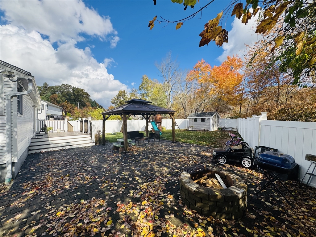27 Fitchburg Street Marlborough, MA 01752 - Photo 31 of 37 a view of a backyard with sitting area