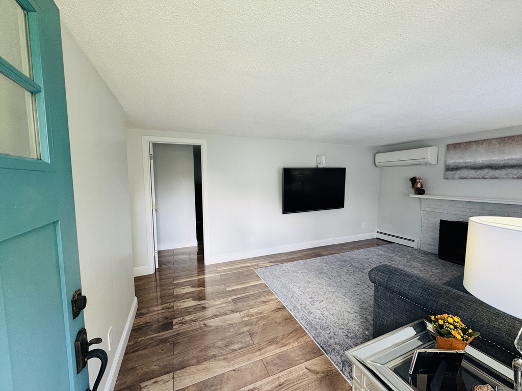 27 Fitchburg Street Marlborough, MA 01752 - Photo 5 of 37 a living room with furniture and a flat screen tv