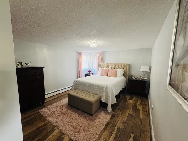 a bedroom with a bed and a black walk in closet