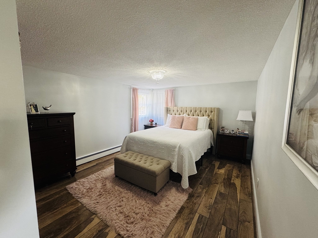 27 Fitchburg Street Marlborough, MA 01752 - Photo 7 of 37 a bedroom with a bed and a black walk in closet