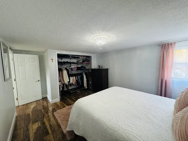 a bed room with a bed and a book shelf