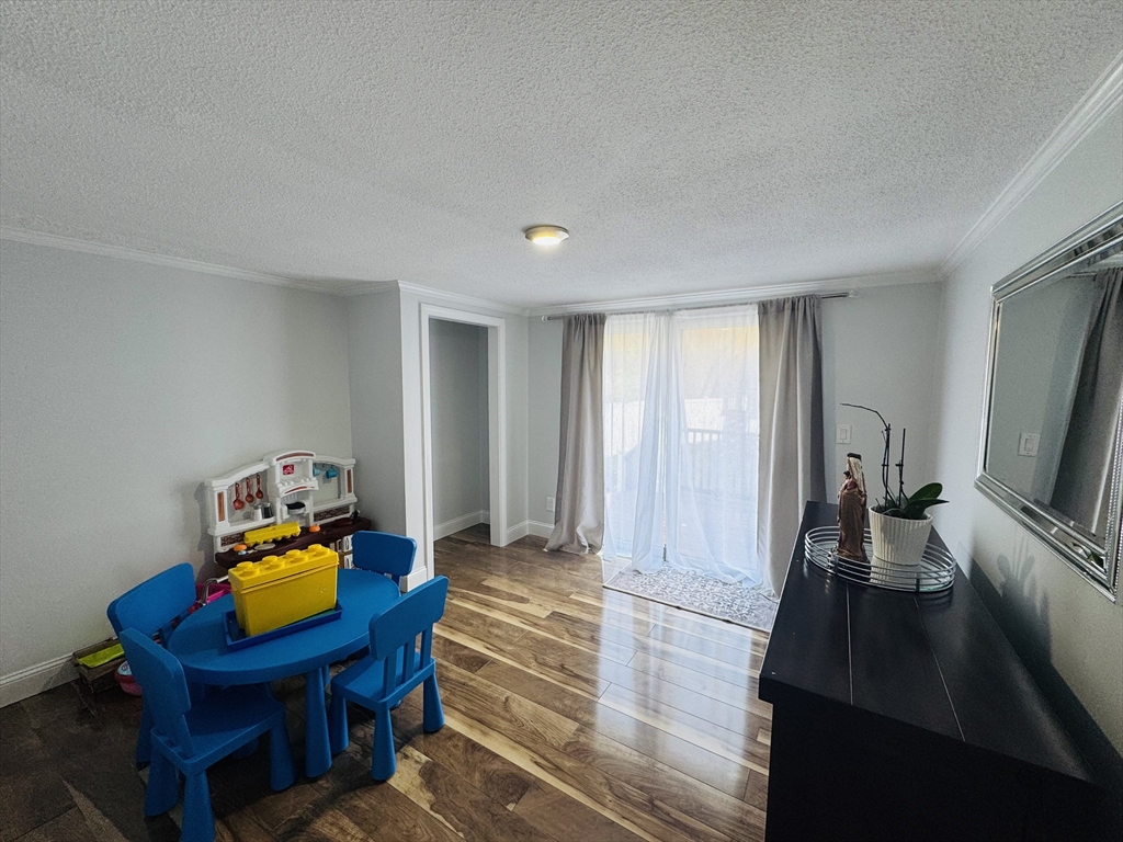 27 Fitchburg Street Marlborough, MA 01752 - Photo 9 of 37 a living room with furniture and a flat screen tv
