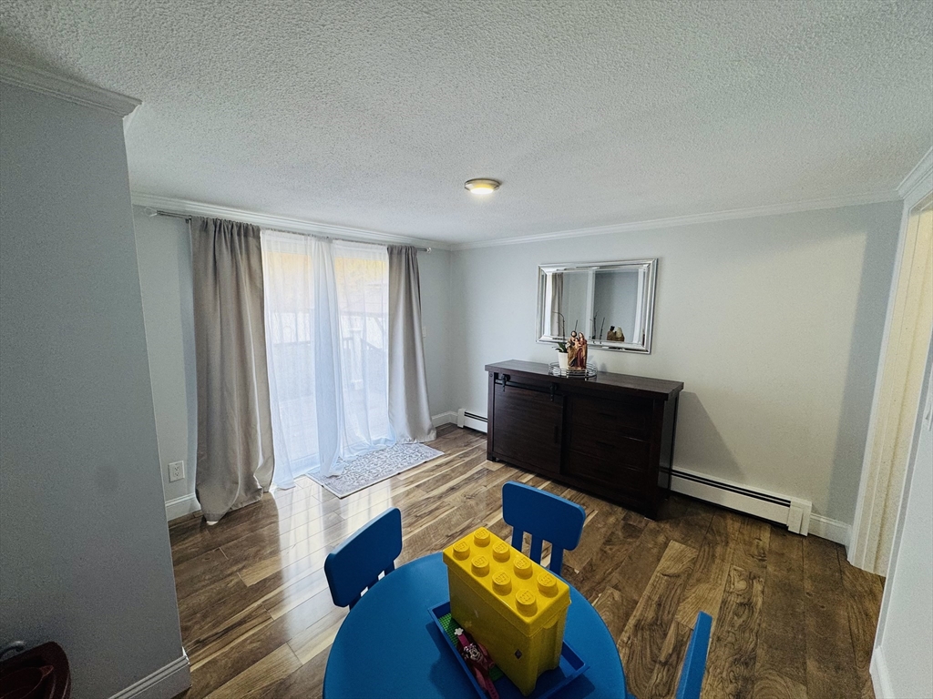 27 Fitchburg Street Marlborough, MA 01752 - Photo 10 of 37 a living room with furniture and a wooden floor