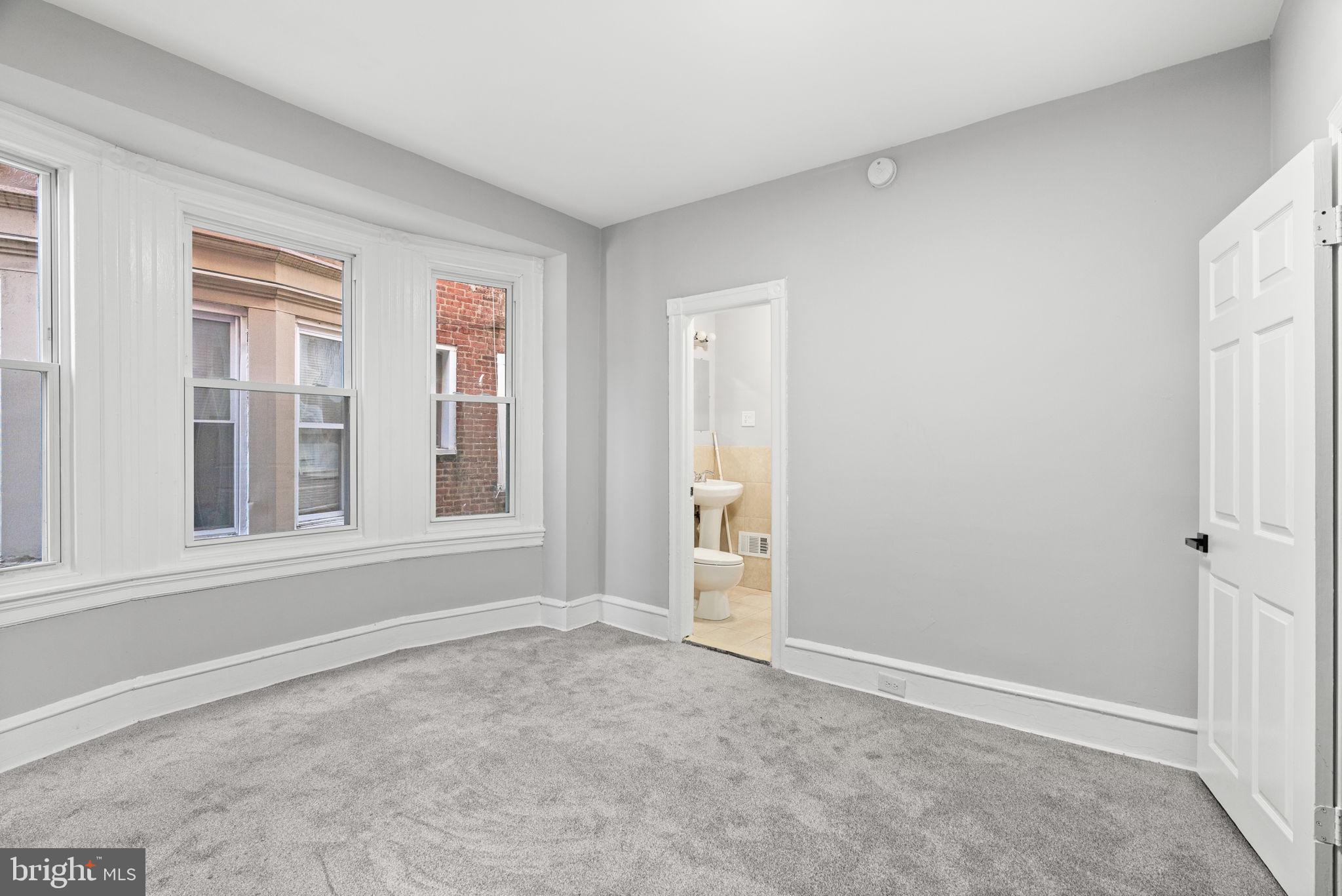 147 Manheim Street Philadelphia, PA 19144 - Photo 12 of 37 an empty room with windows