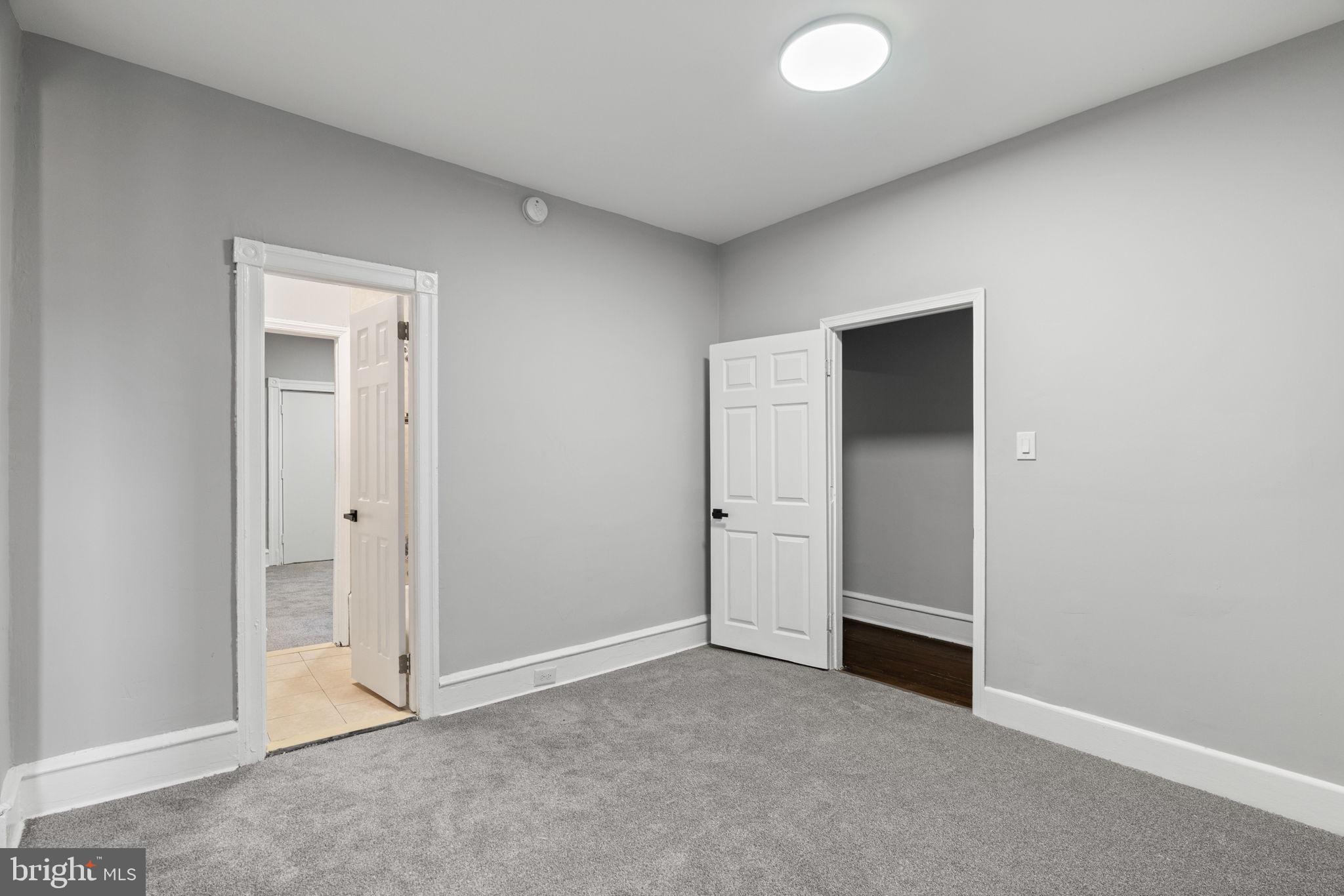 147 Manheim Street Philadelphia, PA 19144 - Photo 13 of 37 an empty room with closet and mirror