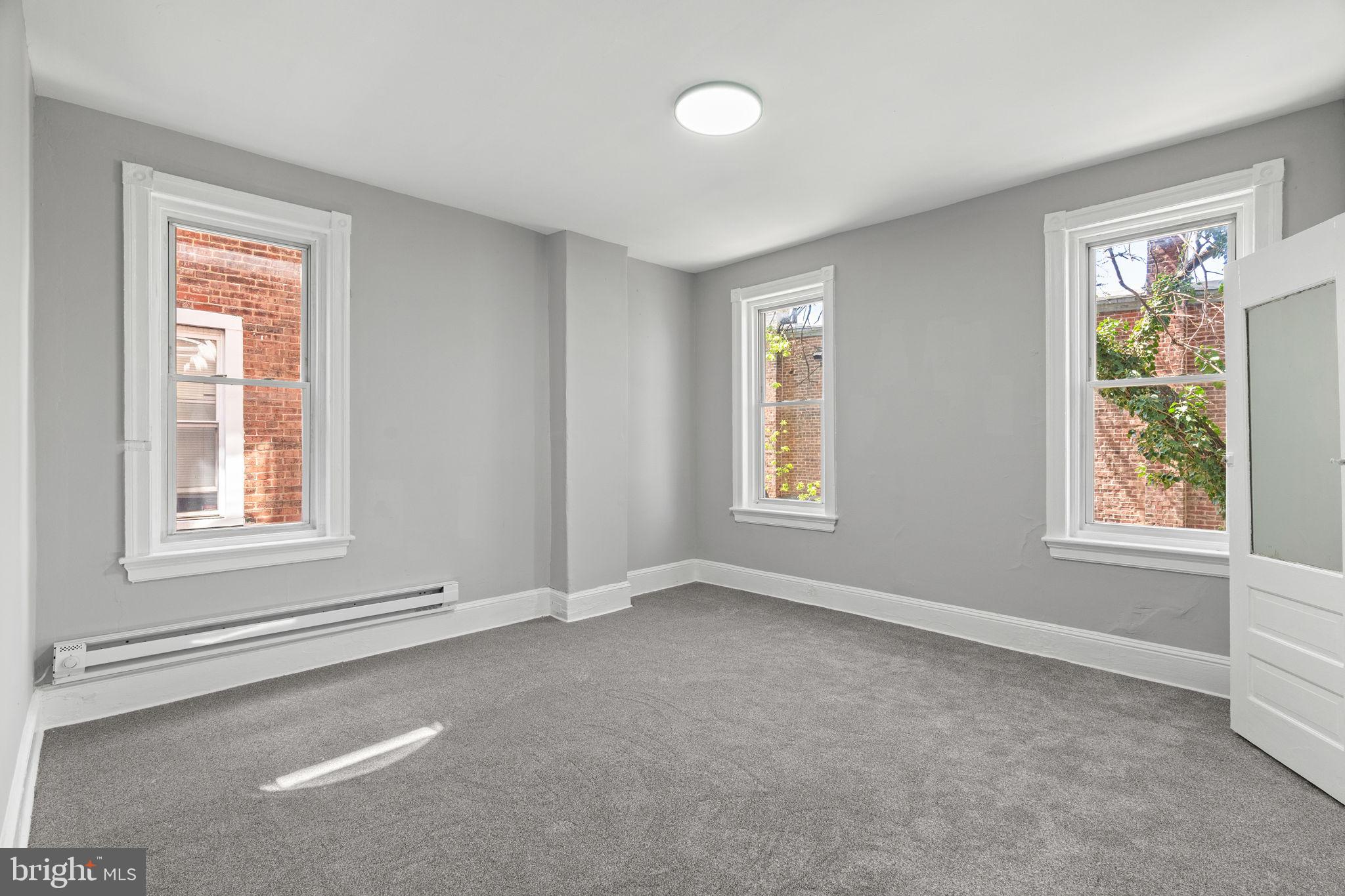 147 Manheim Street Philadelphia, PA 19144 - Photo 15 of 37 an empty room with windows