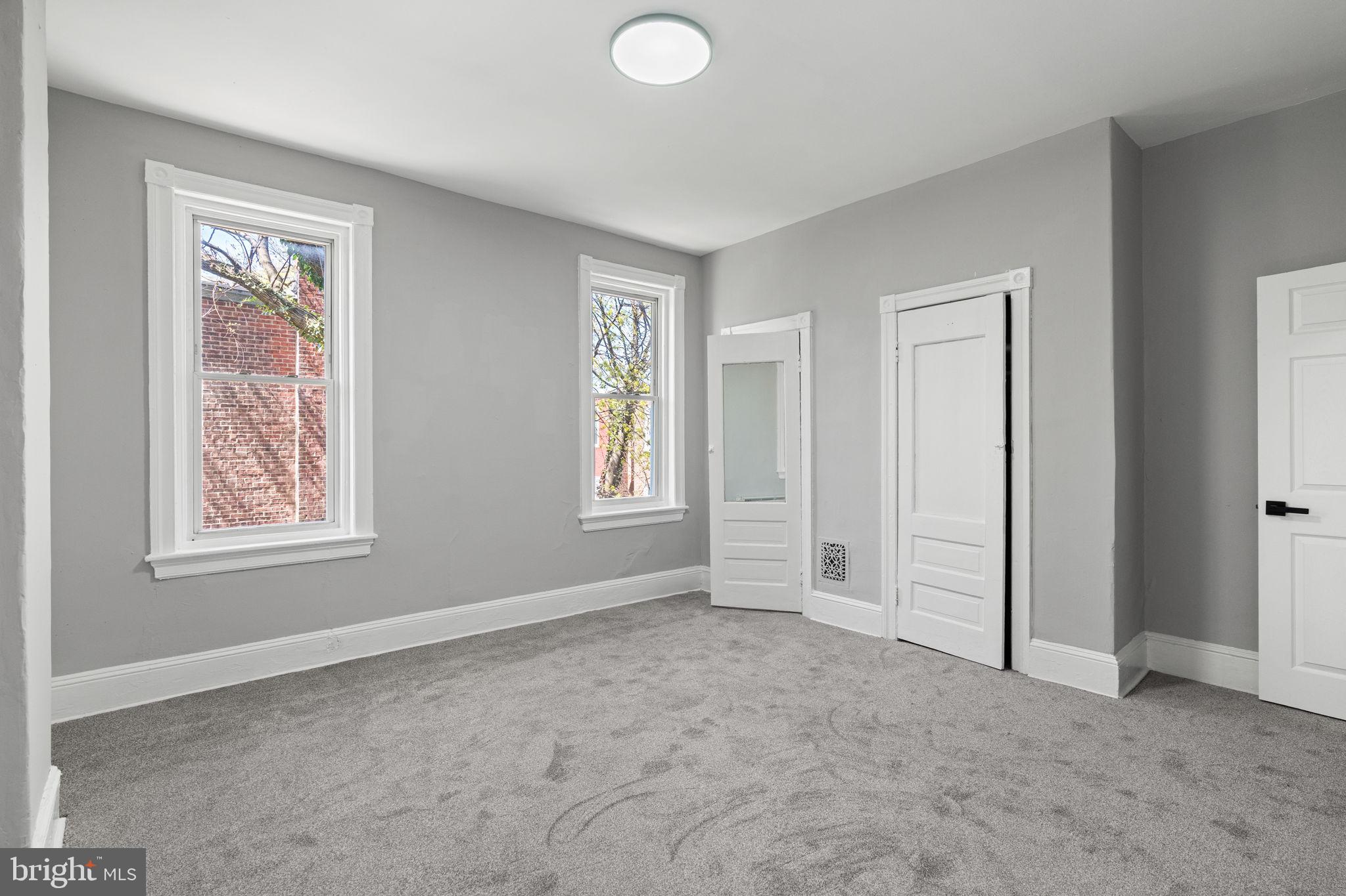 147 Manheim Street Philadelphia, PA 19144 - Photo 16 of 37 an empty room with windows and closet