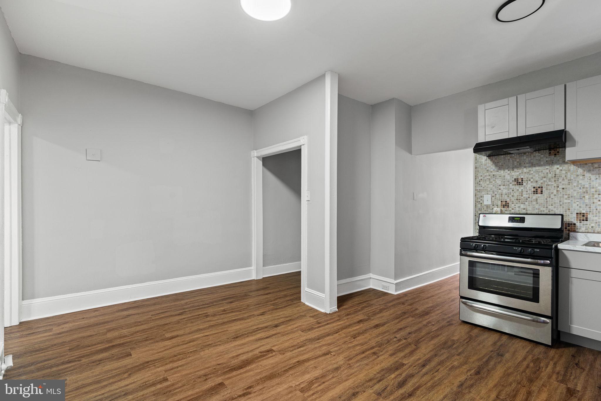 147 Manheim Street Philadelphia, PA 19144 - Photo 18 of 37 a kitchen with wooden floors and appliances