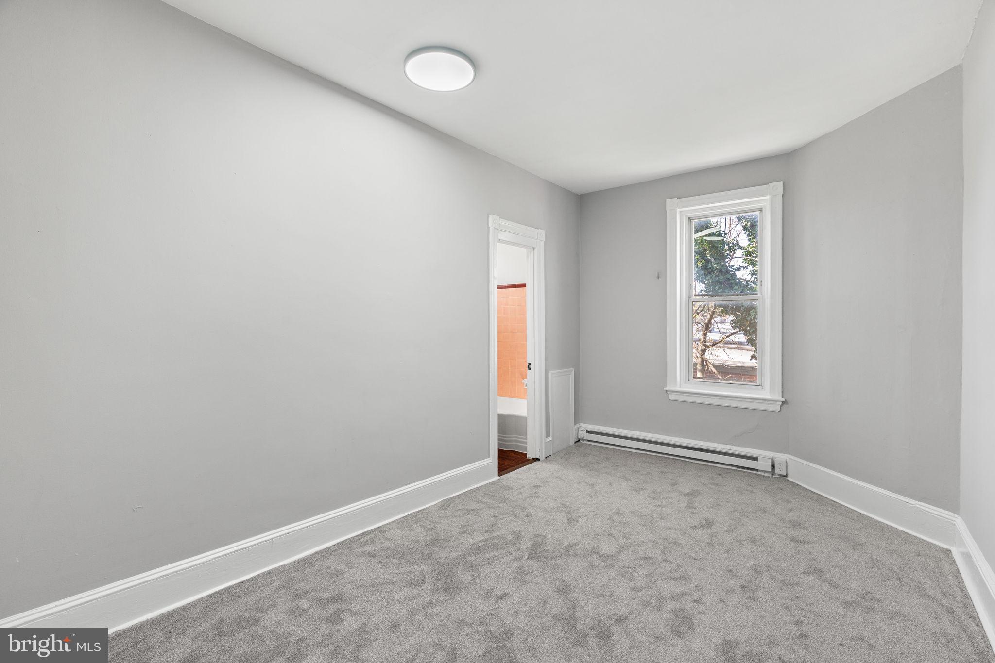 147 Manheim Street Philadelphia, PA 19144 - Photo 27 of 37 an empty room with windows