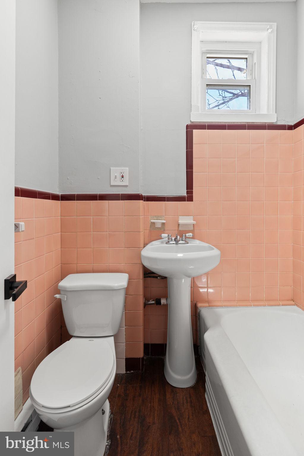 147 Manheim Street Philadelphia, PA 19144 - Photo 29 of 37 a bathroom with a sink a toilet and a mirror