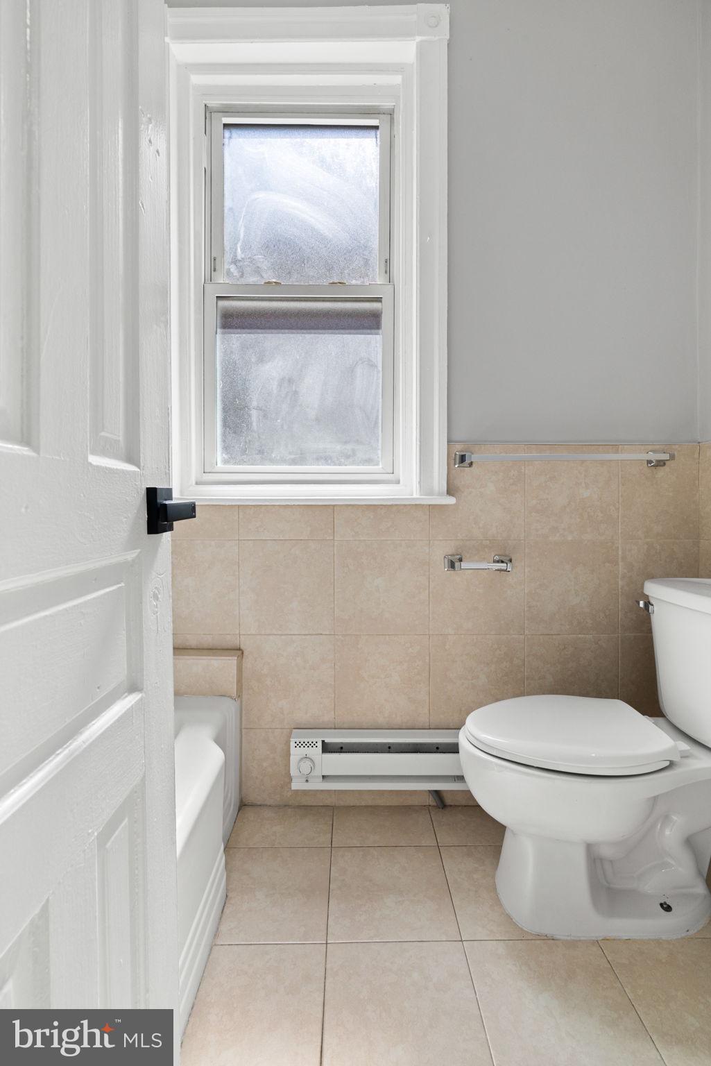 147 Manheim Street Philadelphia, PA 19144 - Photo 34 of 37 a white toilet sitting next to a bathroom sink