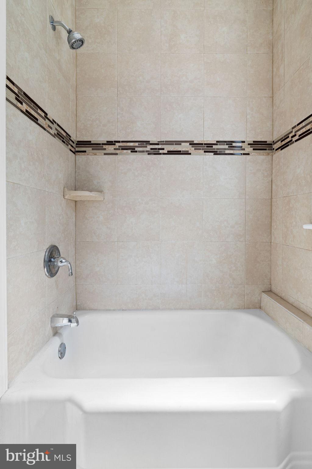 147 Manheim Street Philadelphia, PA 19144 - Photo 35 of 37 a bathroom with a shower and a bath tub