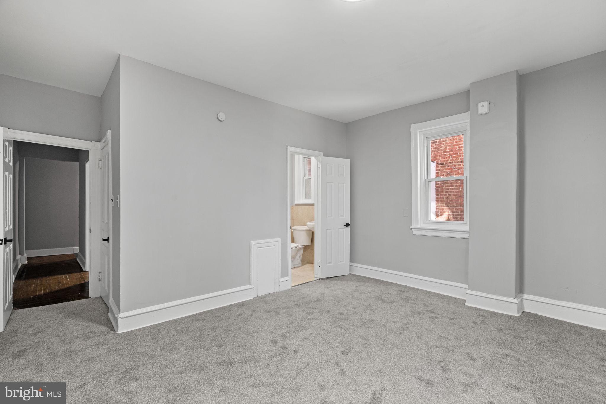 147 Manheim Street Philadelphia, PA 19144 - Photo 8 of 37 a view of an empty room with closet and a window