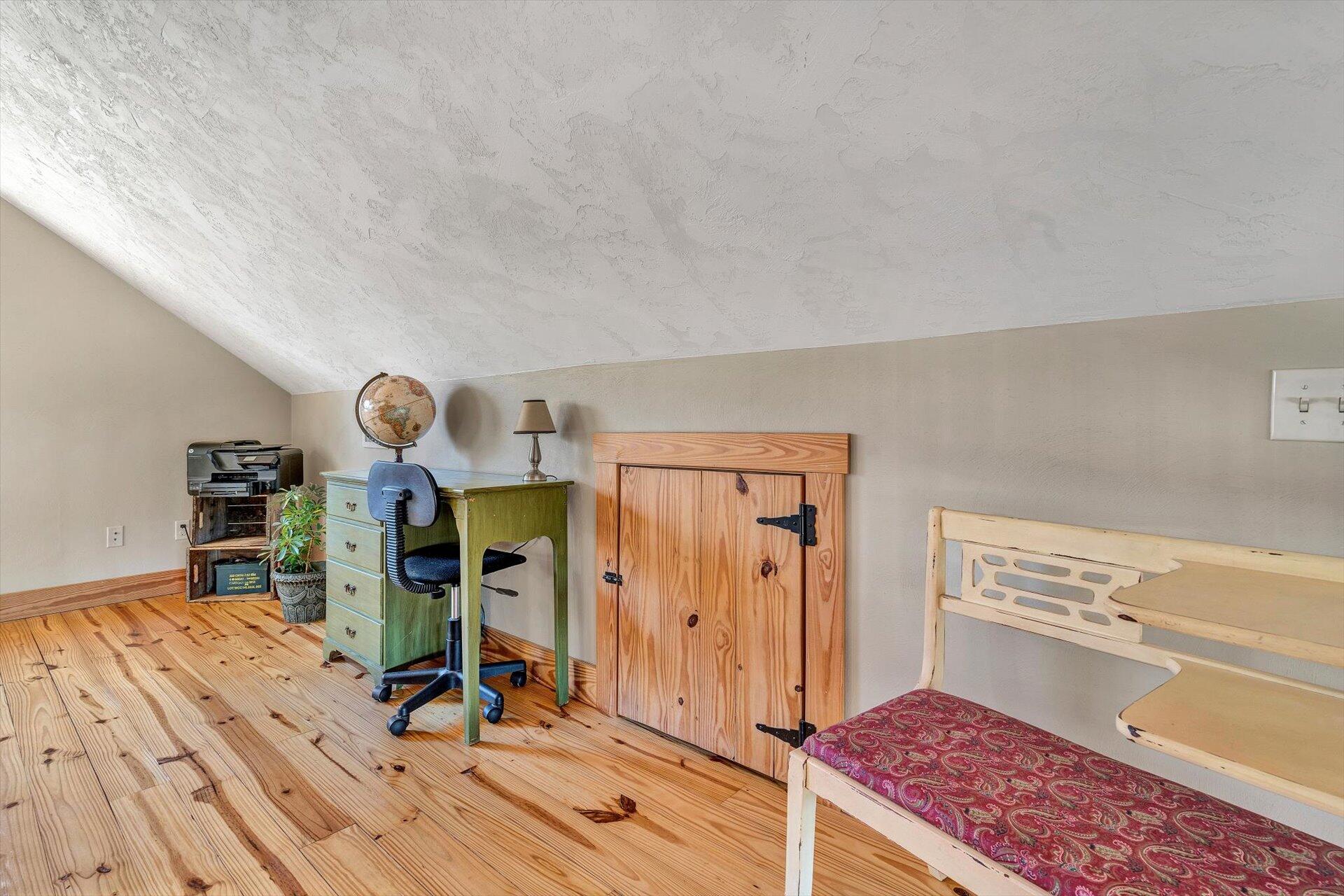 4076 Aerospace Road Roanoke, VA 24014 - Photo 30 of 62 a view of a bedroom with furniture and wooden floor