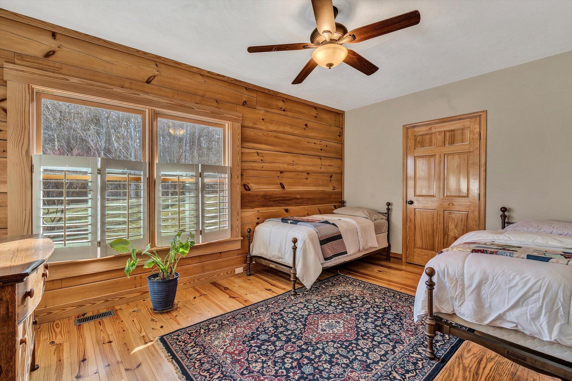 4076 Aerospace Road Roanoke, VA 24014 - Photo 39 of 62 a bedroom with a bed and wooden floor