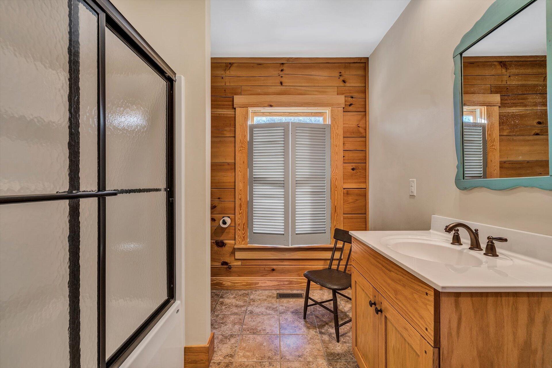 4076 Aerospace Road Roanoke, VA 24014 - Photo 40 of 62 a bathroom with a sink and a mirror