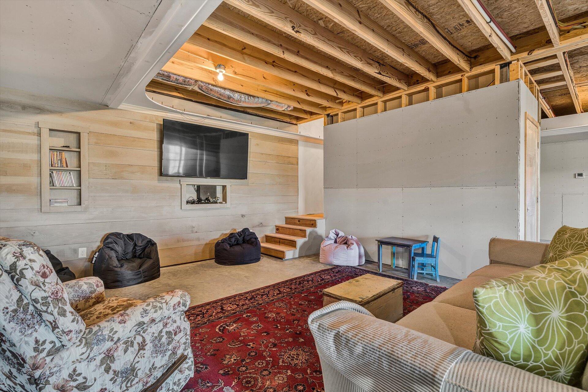 4076 Aerospace Road Roanoke, VA 24014 - Photo 44 of 62 a living room with furniture and a flat screen tv