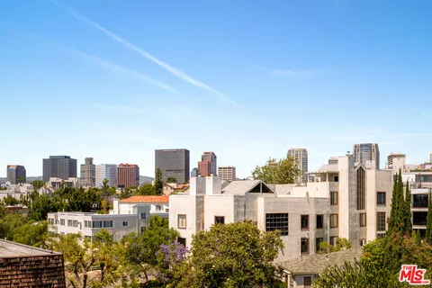 a view of a city with tall buildings
